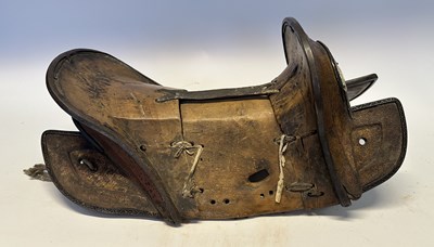 Lot 2 - A TIBETAN SADDLE, BRIDLE, AND A PAIR OF STIRRUPS, 18TH/19TH CENTURY OR EARLIER