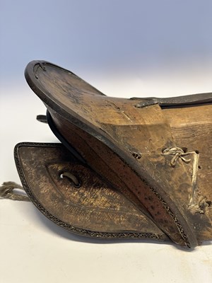 Lot 2 - A TIBETAN SADDLE, BRIDLE, AND A PAIR OF STIRRUPS, 18TH/19TH CENTURY OR EARLIER