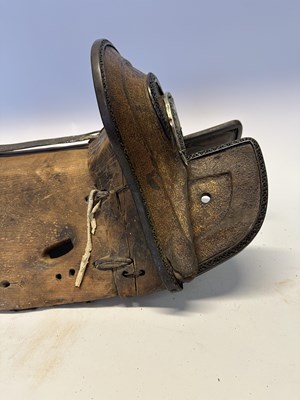 Lot 2 - A TIBETAN SADDLE, BRIDLE, AND A PAIR OF STIRRUPS, 18TH/19TH CENTURY OR EARLIER