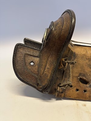 Lot 2 - A TIBETAN SADDLE, BRIDLE, AND A PAIR OF STIRRUPS, 18TH/19TH CENTURY OR EARLIER
