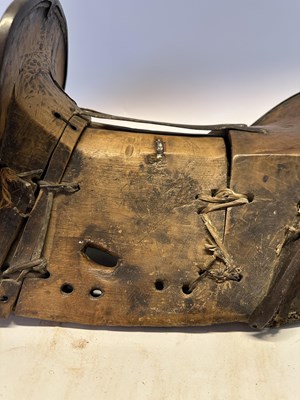 Lot 2 - A TIBETAN SADDLE, BRIDLE, AND A PAIR OF STIRRUPS, 18TH/19TH CENTURY OR EARLIER