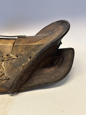 Lot 2 - A TIBETAN SADDLE, BRIDLE, AND A PAIR OF STIRRUPS, 18TH/19TH CENTURY OR EARLIER