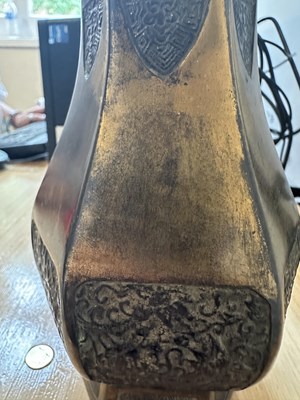 Lot 61 - A CHINESE PARCEL-GILT BRONZE HEXAGONALLY LOBED BOTTLE VASE, QING DYNASTY, 18TH CENTURY