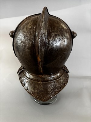 Lot 553 - A CLOSE-HELMET IN LATE 16TH/EARLY 17TH CENTURY STYLE, 19TH CENTURY