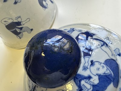 Lot 11 - A LARGE PAIR OF CHINESE BLUE AND WHITE 'HUNDRED BOYS' VASES AND COVERS, QING DYNASTY, 18TH CENTURY