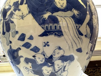 Lot 11 - A LARGE PAIR OF CHINESE BLUE AND WHITE 'HUNDRED BOYS' VASES AND COVERS, QING DYNASTY, 18TH CENTURY