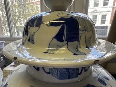 Lot 11 - A LARGE PAIR OF CHINESE BLUE AND WHITE 'HUNDRED BOYS' VASES AND COVERS, QING DYNASTY, 18TH CENTURY