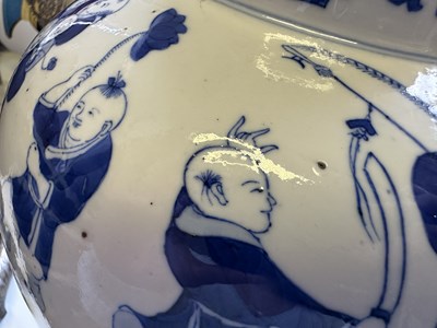 Lot 11 - A LARGE PAIR OF CHINESE BLUE AND WHITE 'HUNDRED BOYS' VASES AND COVERS, QING DYNASTY, 18TH CENTURY