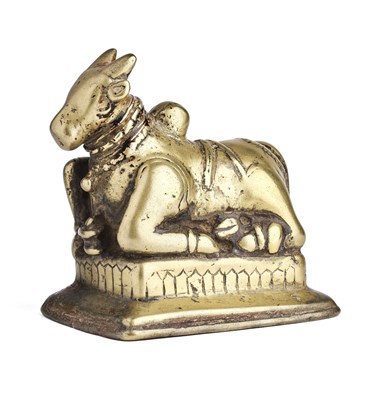 Lot 129 - A BRASS FIGURE OF NANDI BULL, WESTERN DECCAN, INDIA, 18TH CENTURY