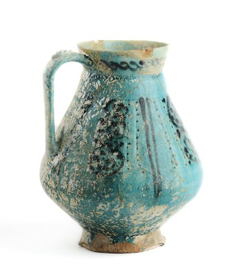 Lot 68 - A TURQUOISE GLAZED JUG, KASHAN OR GURGAN, CIRCA 12TH CENTURY
