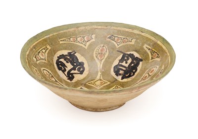 Lot 69 - A NISHAPUR SLIP PAINTED BOWL, PERSIA, CIRCA 10TH CENTURY