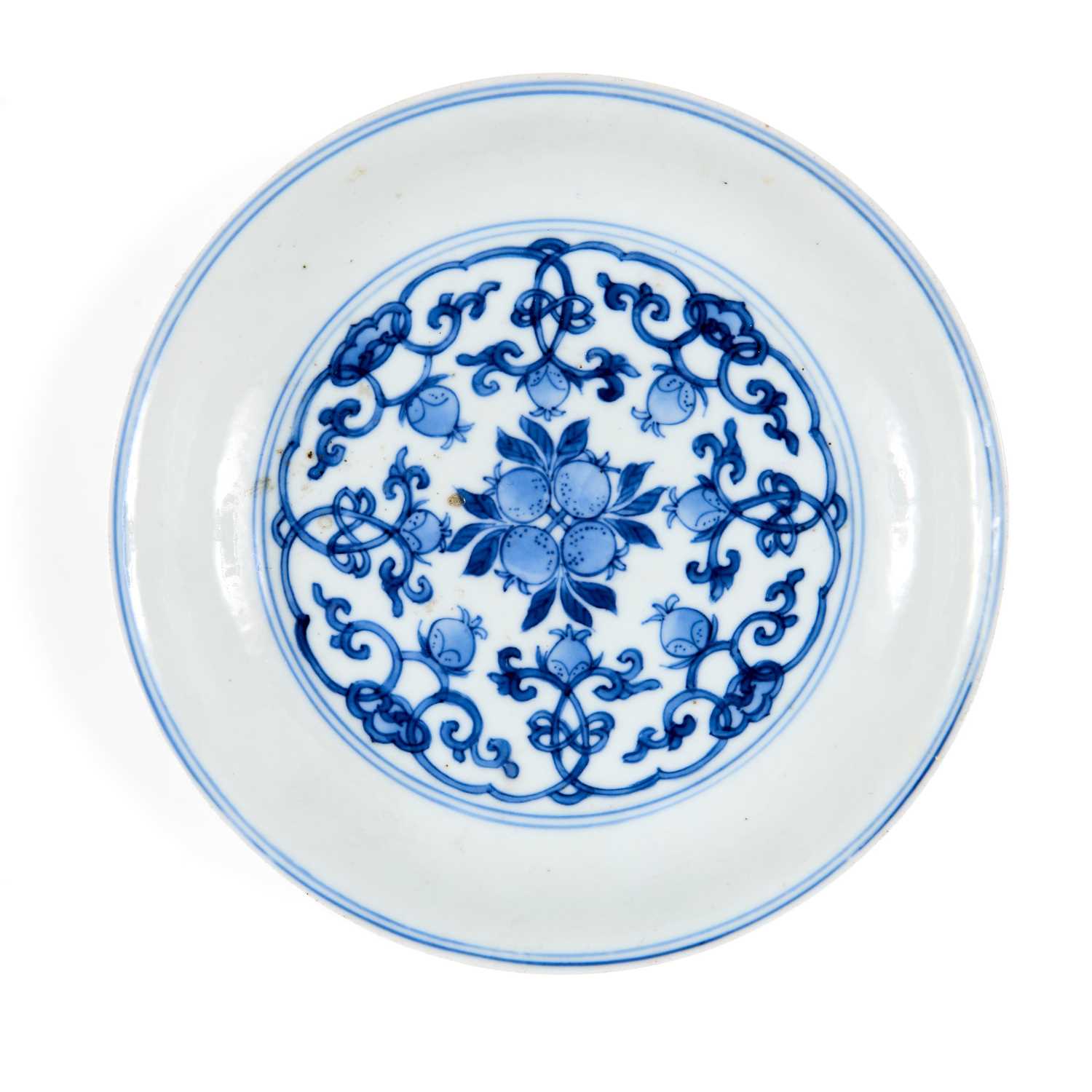 Lot 5 - A CHINESE BLUE AND WHITE PEACH AND POMEGRANATE SAUCER DISH, CHENGHUA MARK, KANGXI PERIOD (1662-1722)