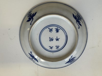 Lot 5 - A CHINESE BLUE AND WHITE PEACH AND POMEGRANATE SAUCER DISH, CHENGHUA MARK, KANGXI PERIOD (1662-1722)