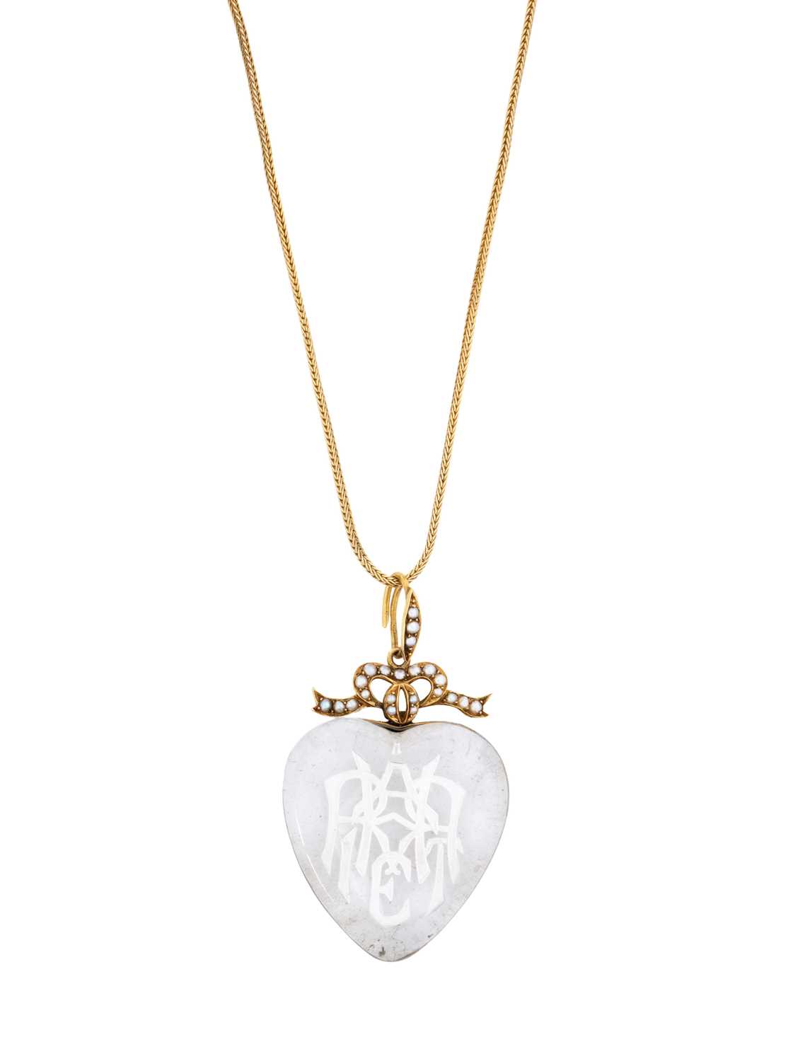 Lot 315 - VICTORIAN ROCK CRYSTAL INTAGLIO, HALF-PEARL AND GOLD PENDANT, 1879