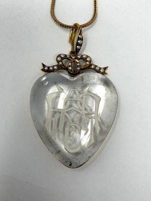 Lot 315 - VICTORIAN ROCK CRYSTAL INTAGLIO, HALF-PEARL AND GOLD PENDANT, 1879