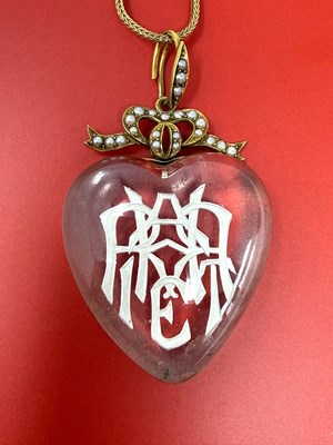 Lot 315 - VICTORIAN ROCK CRYSTAL INTAGLIO, HALF-PEARL AND GOLD PENDANT, 1879
