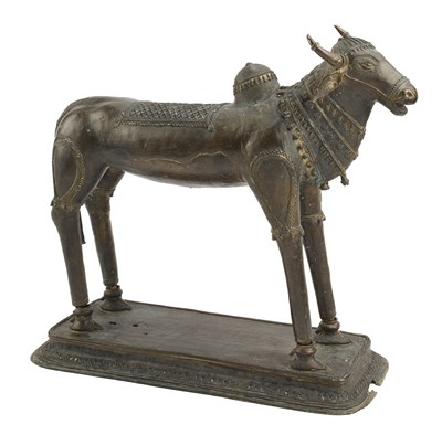Lot 118 - A LARGE BASTAR BRONZE FIGURE OF NANDI, EASTERN INDIA, 19TH CENTURY