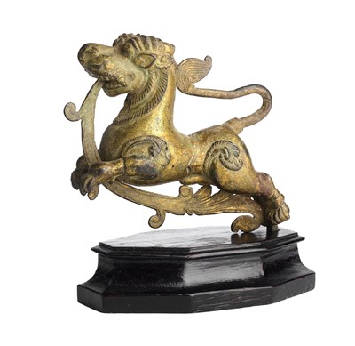 Lot 123 - A COPPER GILT FINIAL IN THE FORM OF A MYTHICAL LION (YALI), SOUTH INDIA, CIRCA 18TH CENTURY