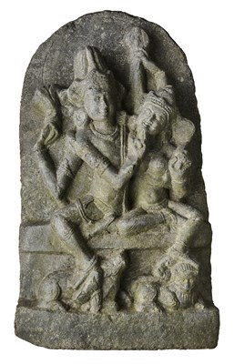Lot 139 - A PALA BLACK STONE STELE DEPICTING UMA-MAHESVARA, BIHAR, INDIA, CIRCA 10TH CENTURY