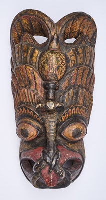 Lot 227 - A SINHALESE CARVED AND PAINTED WOOD RITUAL MASK, SRI LANKA, 19TH CENTURY