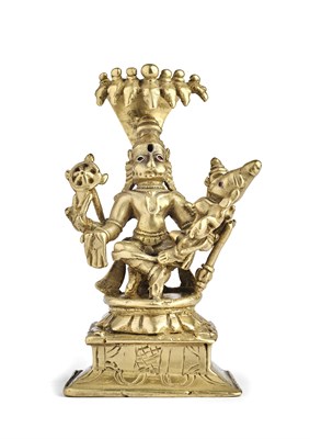Lot 121 - A BRONZE FIGURE OF NARASIMHA WITH HIS CONSORT, DECCAN, SOUTHERN INDIA, CIRCA 18TH CENTURY