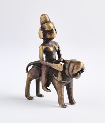 Lot 121 - A SMALL BRONZE FIGURE OF DURGA ON HER LION, WESTERN DECCAN, INDIA, 17TH/18TH CENTURY