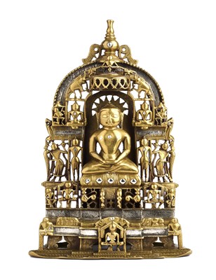 Lot 127 - A JAIN BRASS SHRINE DEPICTING SAMBHAVANATHA, GUJARAT, WESTERN INDIA, DATED SAMVAT 1632/1575 AD
