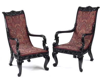 Lot 163 - A PAIR OF ANGLO-SINHALESE EBONY ARMCHAIRS, GALLE, SRI LANKA, MID-19TH CENTURY
