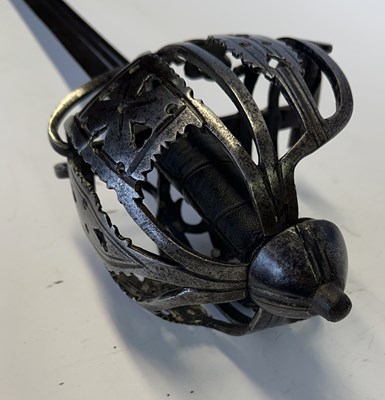 Lot 45 - A SCOTTISH BASKET-HILTED BACKSWORD, SECOND QUARTER OF THE 18TH CENTURY