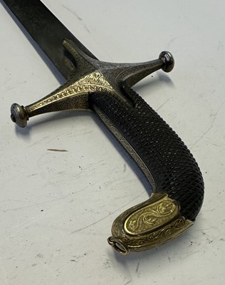 Lot 77 - AN INDO-PERSIAN SHAMSHIR, LATE 18TH/EARLY 19TH CENTURY, AND A NORTH AFRICAN JAMBIYA