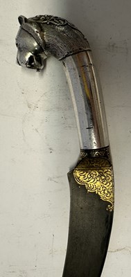 Lot 12 - AN INDIAN SILVER-HILTED KHANJAR WITH LION-HEAD POMMEL, 19TH CENTURY