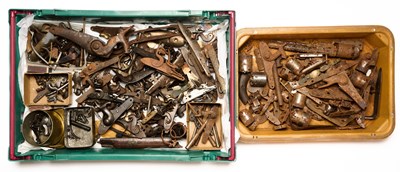 Lot 616 - A LARGE GROUP OF DETACHED LOCK MECHANISMS, COCKS, HAMMERS AND OTHER PARTS RELATING TO FLINTLOCK AND