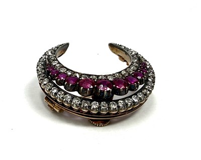 Lot 387 - VICTORIAN RUBY AND DIAMOND CRESCENT MOON BROOCH, 1890s