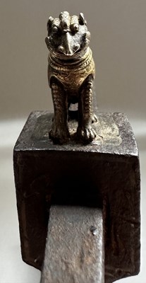Lot 13 - AN INDIAN AXE-HEAD MOUNTED WITH A YALI, 18TH/19TH CENTURY
