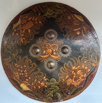 Lot 40 - A RARE INDIAN LACQUERED HIDE DHAL, 19TH CENTURY, PROBABLY RAJPUT