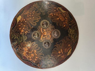 Lot 40 - A RARE INDIAN LACQUERED HIDE DHAL, 19TH CENTURY, PROBABLY RAJPUT