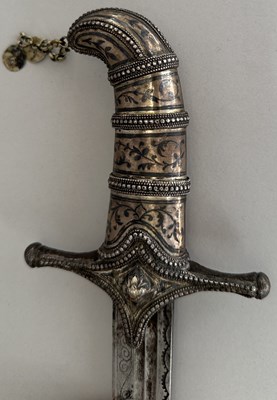 Lot 25 - A CAUCASIAN SWORD WITH NIELLOED SILVER MOUNTS, 19TH CENTURY