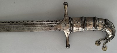 Lot 25 - A CAUCASIAN SWORD WITH NIELLOED SILVER MOUNTS, 19TH CENTURY