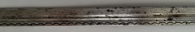Lot 25 - A CAUCASIAN SWORD WITH NIELLOED SILVER MOUNTS, 19TH CENTURY