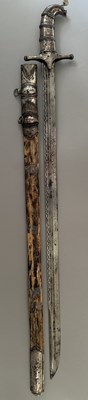 Lot 25 - A CAUCASIAN SWORD WITH NIELLOED SILVER MOUNTS, 19TH CENTURY