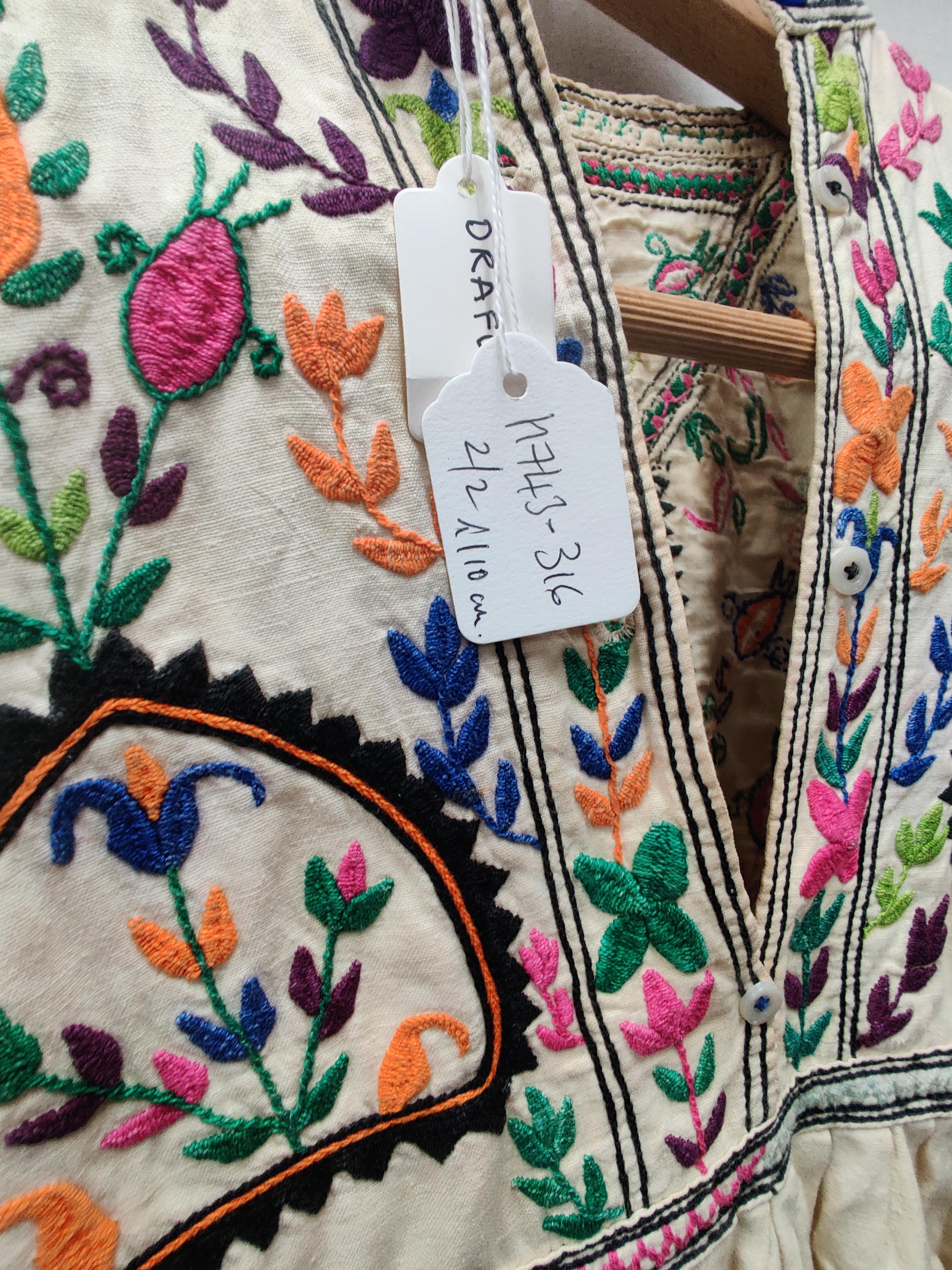 Lot 164 - A HAZARA EMBROIDERED MANS TUNIC, CIRCA 1920,