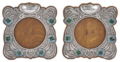 Lot 591 - A NEAR PAIR OF EDWARDIAN SILVER PHOTOGRAPH FRAMES