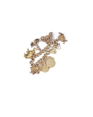 Lot 770 - NINE CARAT GOLD CHARM BRACELET